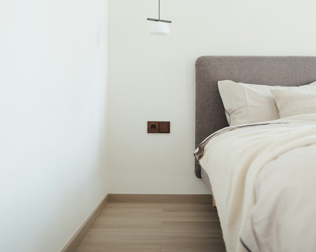 Minimalist bedroom with a neatly made bed