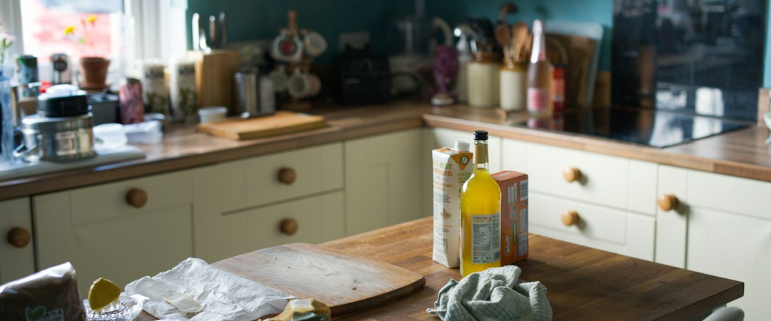 a kitchen counter with a few bottles of liquid on it